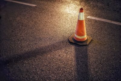 High angle view of illuminated lamp on road