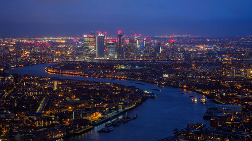 High angle view of illuminated buildings in city at night