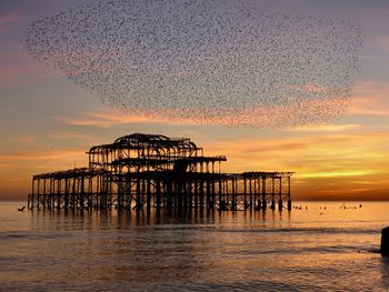 Scenic view of sea against sky at sunset