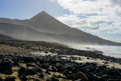 Scenic view of beach against sky