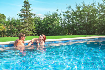 Woman swimming in pool
