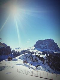 Scenic view of snowcapped mountains against clear blue sky