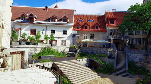 Houses in town against sky