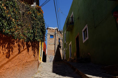 Narrow alley along buildings