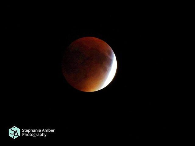 LOW ANGLE VIEW OF MOON IN THE DARK