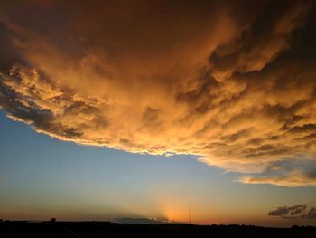 Low angle view of dramatic sky during sunset