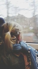 Rear view of a girl in car