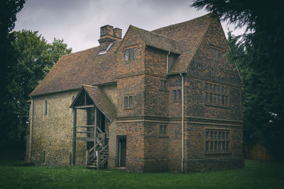 House on field against sky