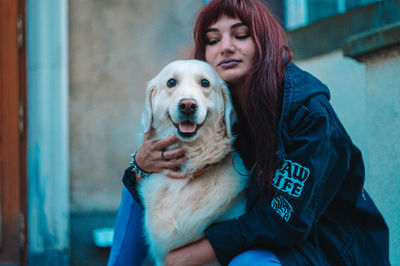 Portrait of dog with camera at home