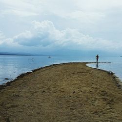 Scenic view of sea against cloudy sky