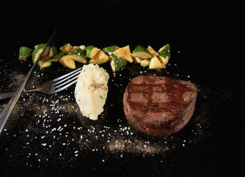 Close-up of food against black background