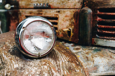 Close-up of old rusty car headlight