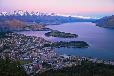 Scenic view of lake and mountains against sky