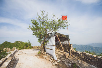 Lifeguard hut on mountain against sky