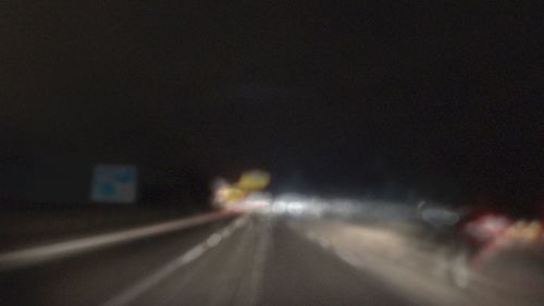 Cars on road at night