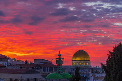 Bloody red sky above the dome of the rock in jerusalem