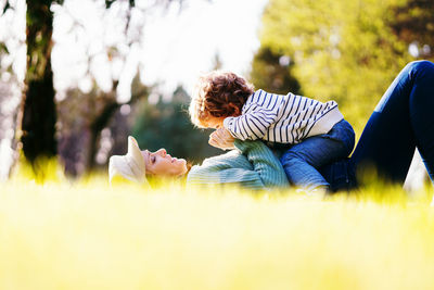 People relaxing on land