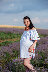 Young woman standing on field