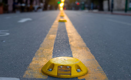 Close-up of yellow toy car on road