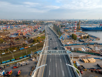 Aerial photo of cars driving on multi-lane highway. elevated bridge with high speed road. 