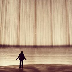 Silhouette of man on stage