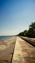 View of empty beach against clear sky