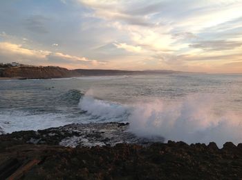 Scenic view of sea against dramatic sky