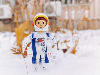 Stuffed toy on snow during winter