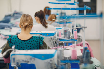 Rear view of woman working