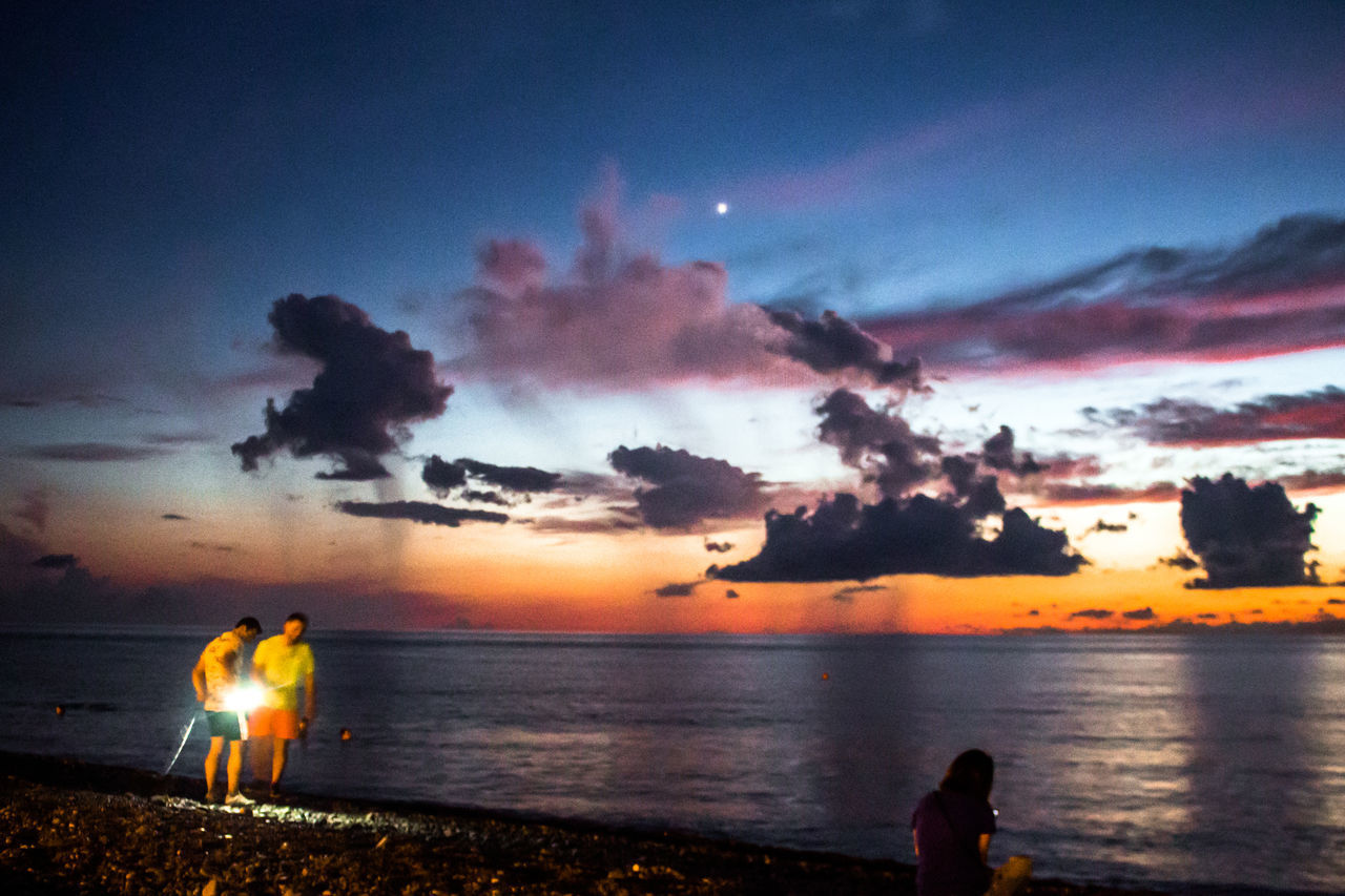 SCENIC VIEW OF SUNSET OVER SEA