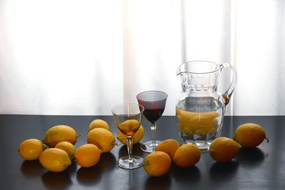 Fruits in glass on table