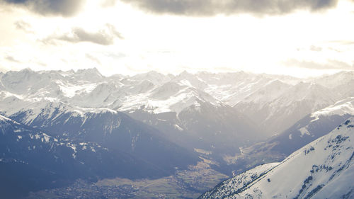 Scenic view of mountains against sky during winter