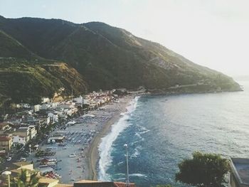 Scenic view of sea with mountain range in background