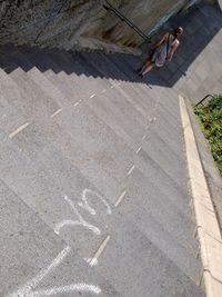 High angle view of woman going down stairs