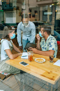 Young business people at an informal business meeting in a coffee shop