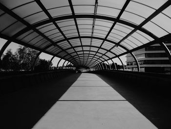 Empty elevated walkway in city