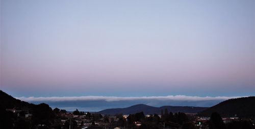 Scenic view of silhouette mountains against sky at dusk