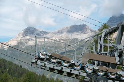 Cable car on mountain against sky