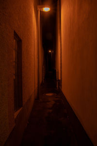 Empty corridor along buildings