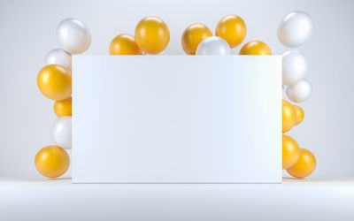 Close-up of yellow juice over white background