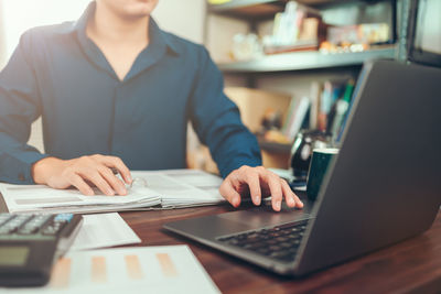 Man using laptop on table