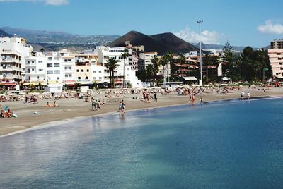 People at beach on sunny summer day