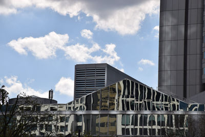 Low angle view of building against cloudy sky
