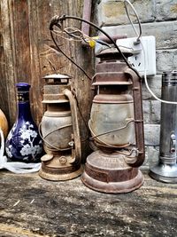 Old lantern hanging against wall