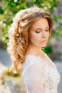 Portrait of beautiful young woman with eyes closed