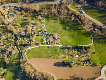 High angle view of road amidst trees and buildings