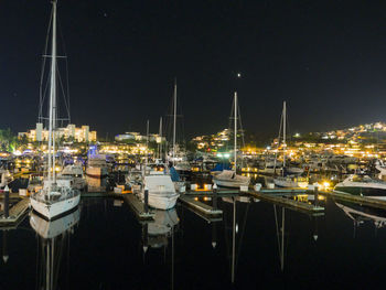 Boats moored at harbor
