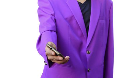 Close-up of man holding smart phone over white background