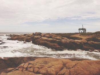 Scenic view of sea against cloudy sky