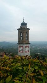 Close-up of clock tower against sky